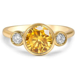 Langerman Diamonds bespoke ring featuring a 2 ct Intense Yellow Orange diamond