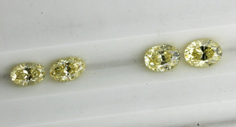 Yellow matching pairs oval diamonds
