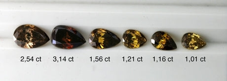Pear shape diamonds going from intense brown to yellowish brown