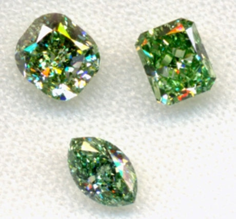 Two fancy intense pure green diamonds and one fancy vivid pure green diamond.