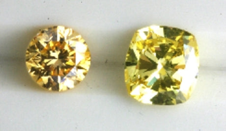 Two nice yellow diamonds, a round and a square one