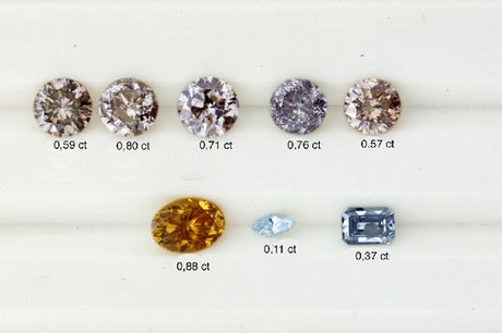 5 different shades of pink diamonds, two blue diamonds and a orange diamond