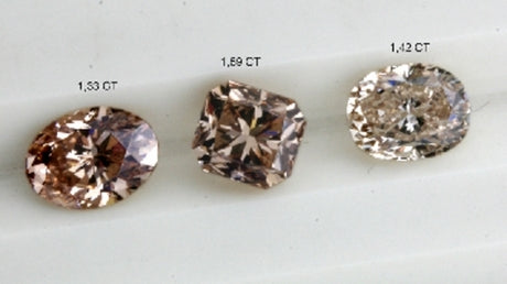 Three brownish pink diamonds, three shades