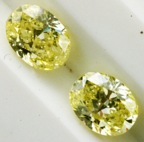 A couple of fancy intense yellow diamonds, weighing 1,11 ct and 1,09 ct