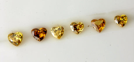 Different shades of orange heart shape diamonds