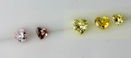 Pink and intense yellow heart shape diamonds