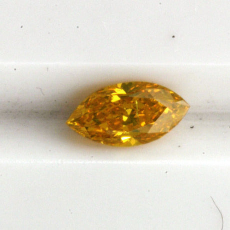 a natural fancy vivid yellowish orange marquise diamond weighing 0,29 ct