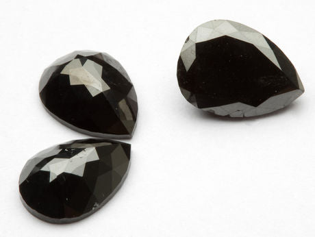 Set of 3 black briolet diamonds.