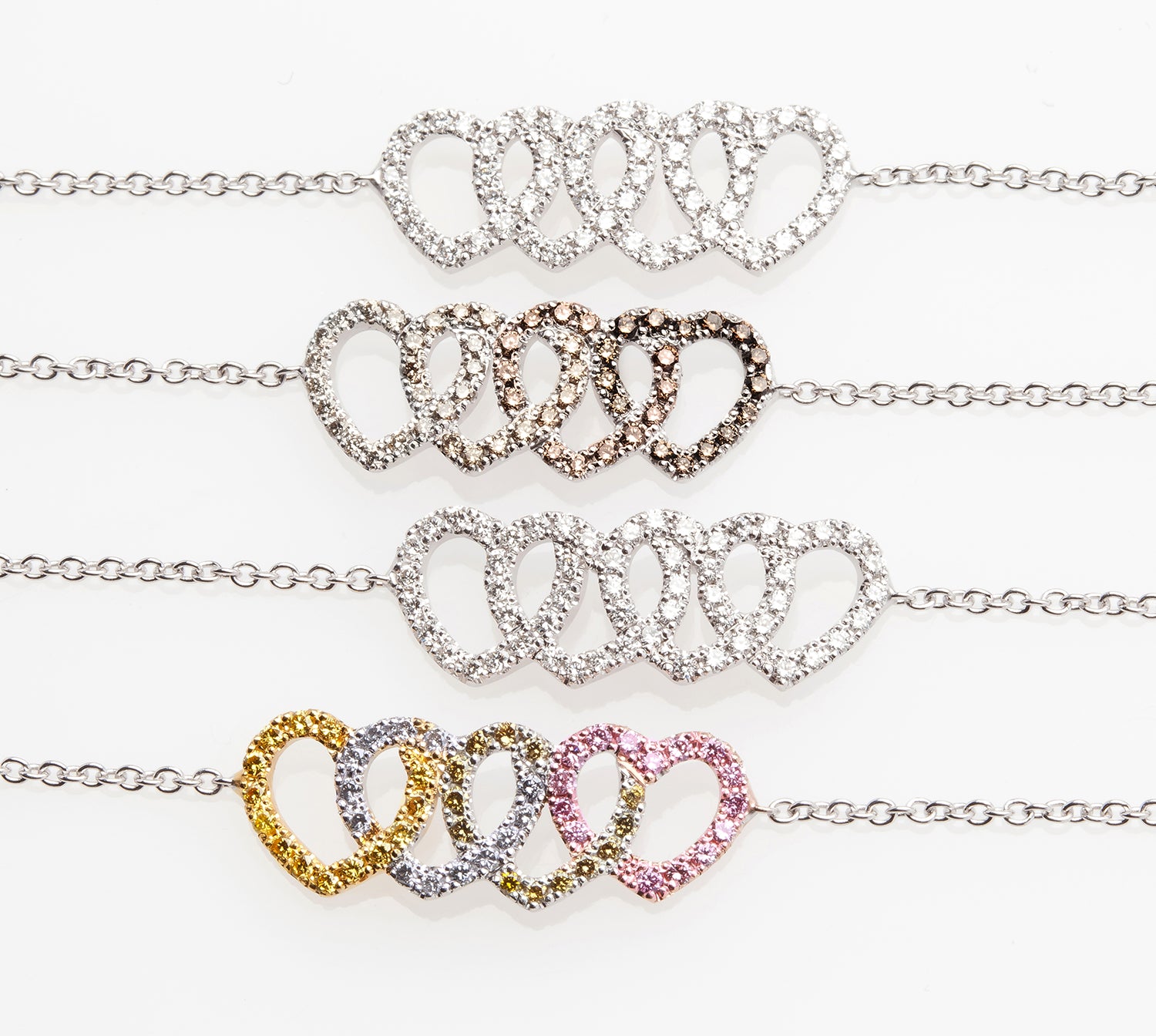 Love bracelets with pavé-set color diamonds.