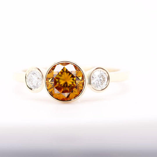 Yellow-Orange Three Stone Ring