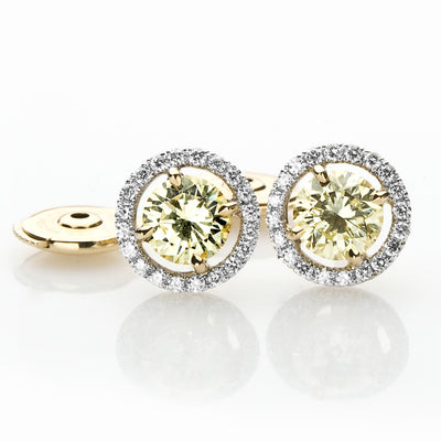 Fancy Yellow Diamond Earrings With a White Diamond Halo